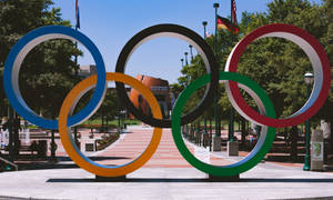 The Olympic Flame Symbolizes Strength And Success Wallpaper
