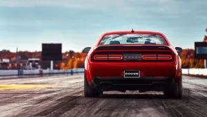The Rear End Of A Red Dodge Challenger Wallpaper