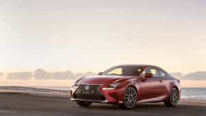 The Red Lexus Rc - F Coupe Is Parked On The Beach Wallpaper