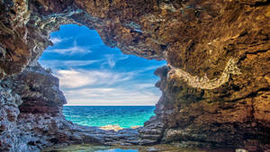 The Serenity Of A Seascape Cave Wallpaper