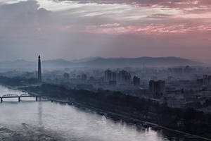 The Skyline Of Pyongyang At Dusk Wallpaper
