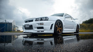 The Unbeatable Pearl White Nissan Skyline Gtr R34 Wallpaper