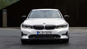 The White Bmw X3 M Sport Is Parked In Front Of A Building Wallpaper