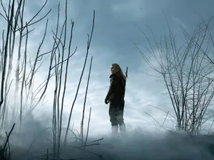 The Witcher Geralt In The Misty Mountain Wallpaper