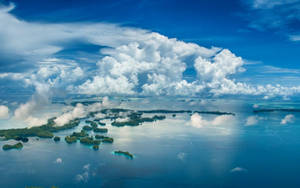 Thick Clouds Covering Palau Islands Wallpaper