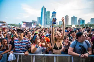 Thousands Of Fans Having A Great Time Enjoying The Music At Lollapalooza In Chicago Wallpaper