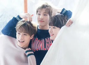 Three Friends Smiling Behind Curtain Wallpaper