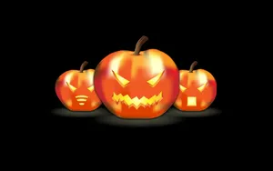 Three Horrific Pumpkins Simple Halloween Wallpaper