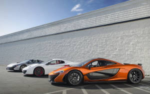 Three Mclaren Spyder Vehicles Parked Wallpaper