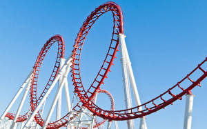 Thrilling Double Loop Roller Coaster Ride Wallpaper