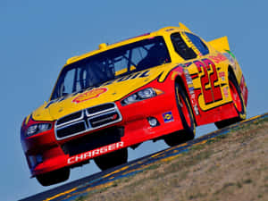 Thrilling Nascar Race In Action Wallpaper