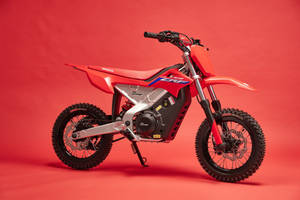 Thrilling Red Electric Dirtbike Wallpaper