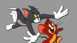 Tom Cat And Jerry Playing Together Wallpaper