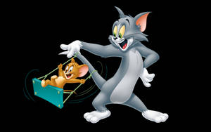 Tom Cat While Swinging Jerry Wallpaper