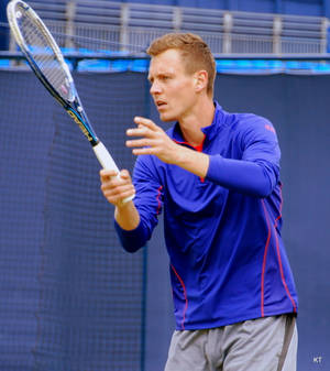 Tomas Berdych Holding Racket Blue Backdrop Wallpaper