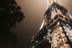 Tower In Paris At Night Wallpaper