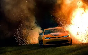 Transformers Bumblebee Zooming Through An Explosion Wallpaper