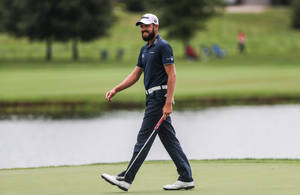 Troy Merritt, Smiling And Enjoying His Walk On The Golf Course Wallpaper