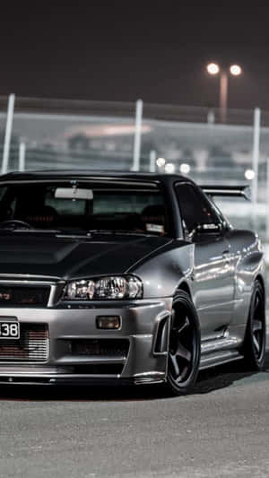 Turn Heads In The Sleek And Powerful Nissan Skyline. Wallpaper