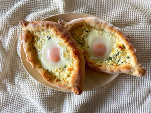 Two Beautifully Baked Georgian Khachapuri Breads Wallpaper