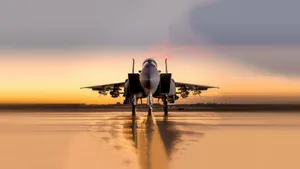 Two Military Jets Soaring Through Clouds Wallpaper