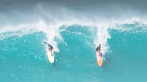 Two People Surfing Side-by-side Wallpaper