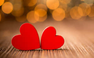 Two Red Hearts Wooden Background Wallpaper