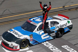 Tyler Reddick Standing On The Window Wallpaper