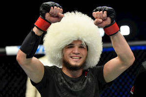 Umar Nurmagomedov Smiling Triumphantly Wallpaper