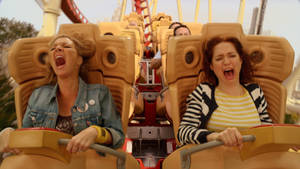Unbreakable Kimmy Schmidt Riding Roller Coaster Wallpaper