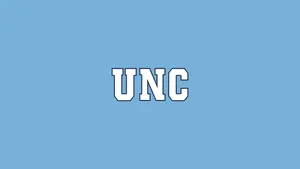 Unc Logo On A Blue Background Wallpaper