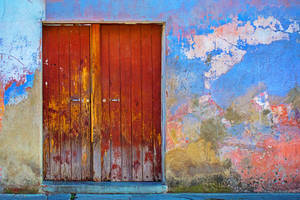 Unique Door In Rust Yellow Hues Wallpaper