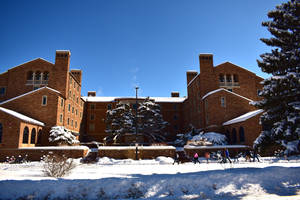 University With Brick Building Wallpaper