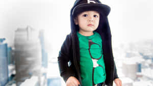 Urban Style Trendsetter - Stylish Boy In Hoodie And Cap Wallpaper