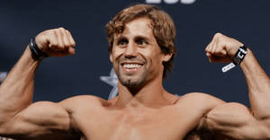 Urijah Faber Smiling And Flexing Wallpaper
