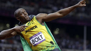 Usain Bolt Is Cheered On As He Takes The Gold Medal At The Olympics Wallpaper