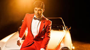 Varun Dhawan On A Vintage Car Wallpaper