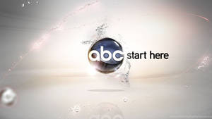 Vibrant Abc Logo Immersed In A Water Splash Effect Wallpaper