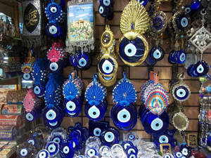 Vibrant Array Of Evil Eye Charms Hanging Against A Light Background Wallpaper