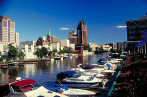 Vibrant Cityscape Of Milwaukee At Dusk Wallpaper