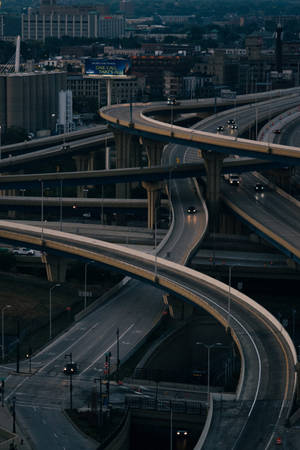 Vibrant Evening In Milwaukee's Freeway System Wallpaper