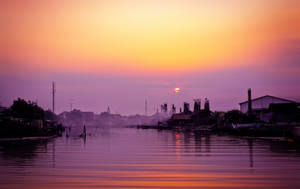 Vibrant Life Along Jakarta's Riverside Wallpaper