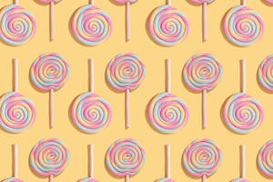 Vibrant Lollipop Candies Pattern Wallpaper