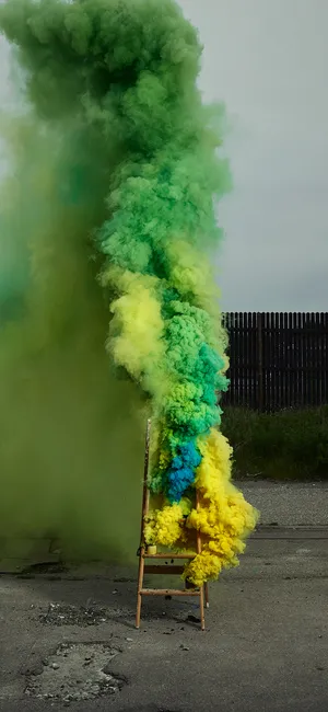 Vibrant Mixture Of Yellow And Green Smoke Wallpaper