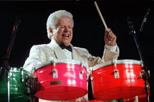 Vibrant Persona Of Tito Puente, The Latin Music Maestro Wallpaper