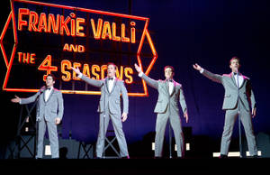 Vibrant Portrait Of Frankie Valli And The Four Seasons Wallpaper