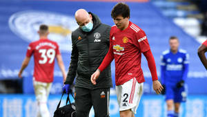 Victor Lindelof Injured Leaving Field Wallpaper