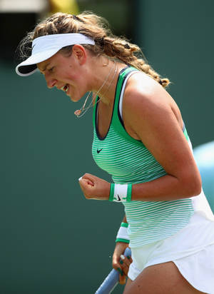 Victoria Azarenka Fist Pump In Green Wallpaper