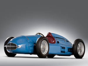 Vintage Blue F1 Race Car At The Indianapolis 500 Wallpaper