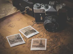 Vintage Camera With Photos Wallpaper